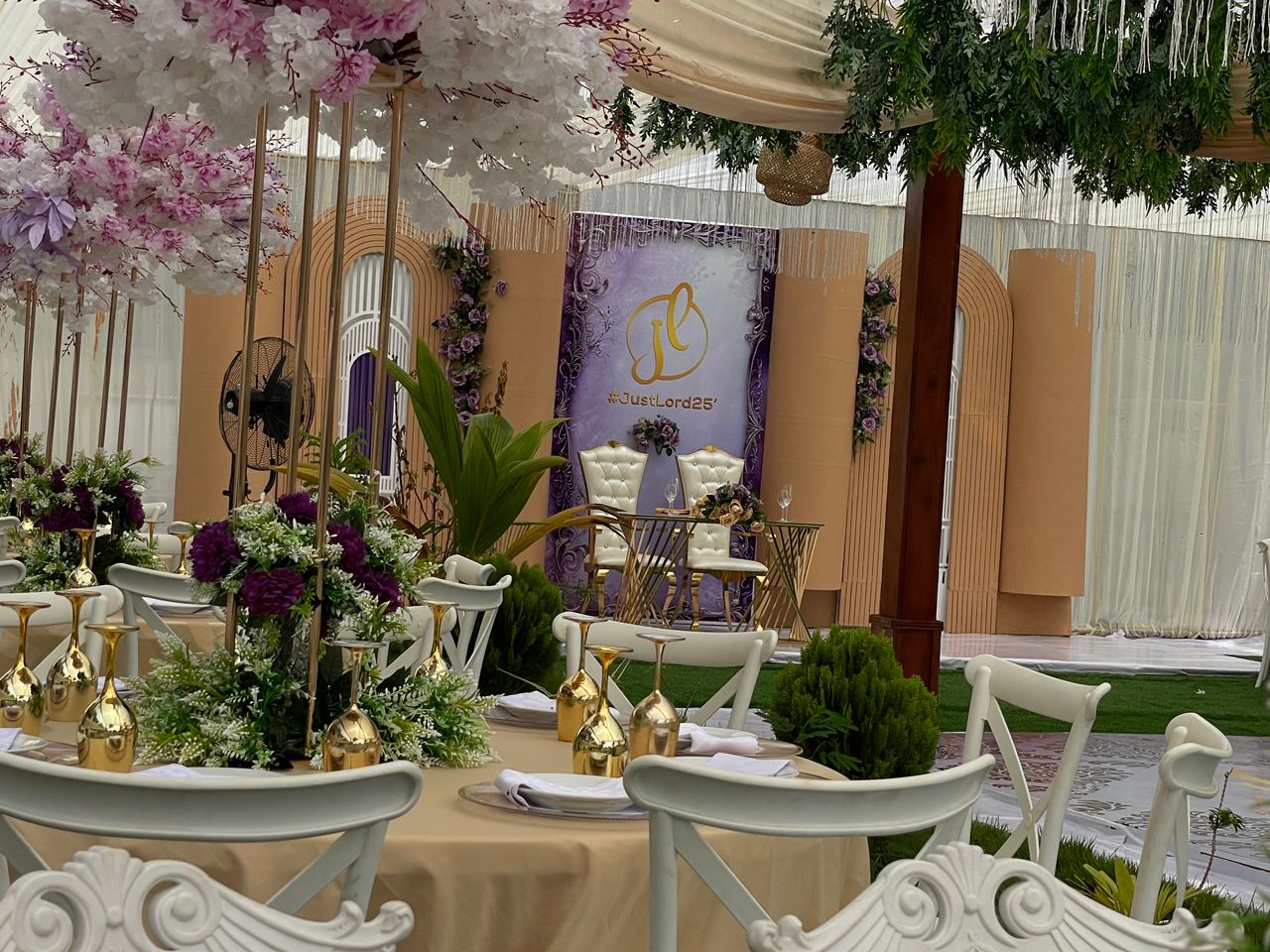 Purple and gold themed event with custom hashtag backdrop